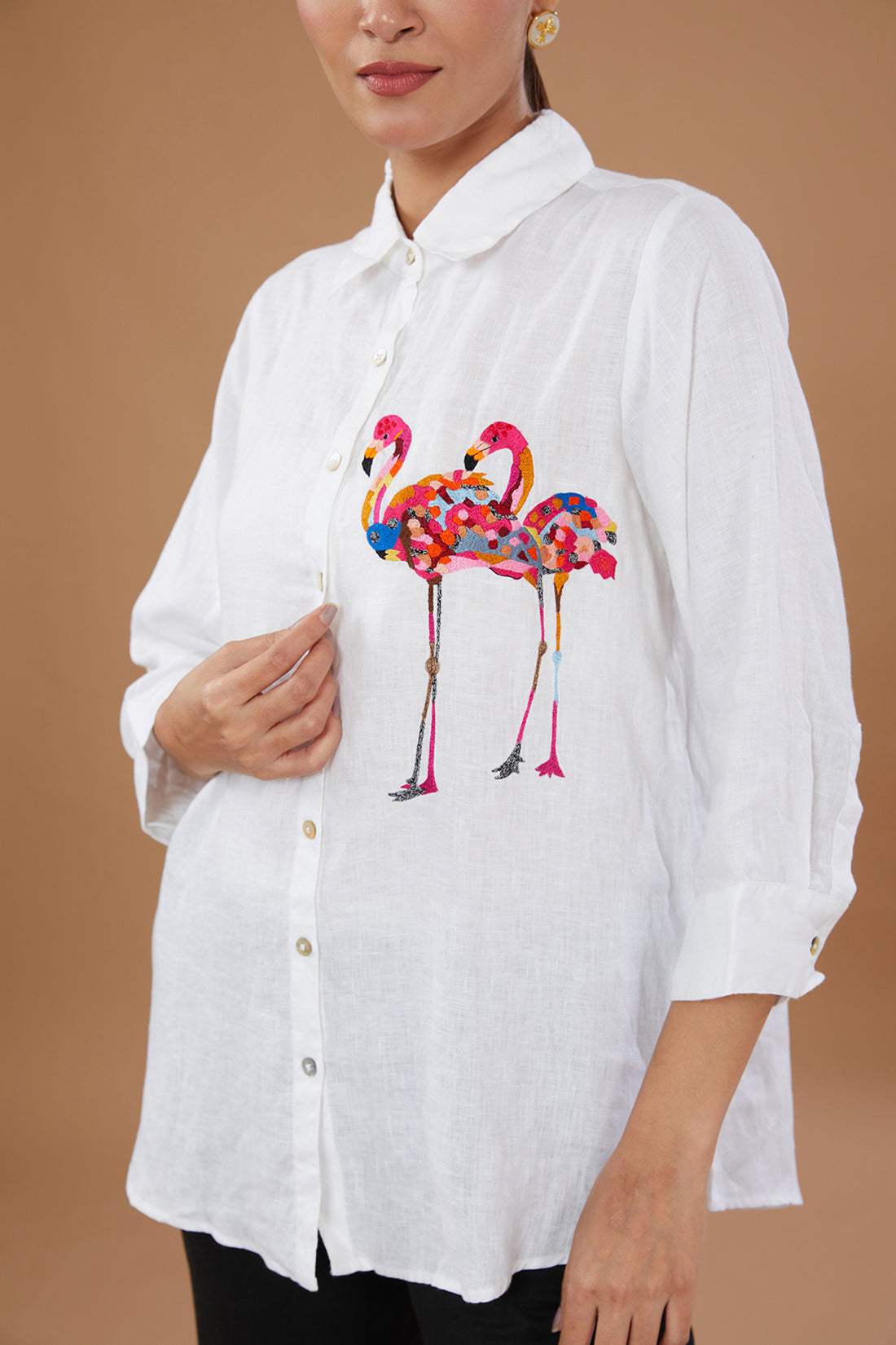 Featuring A White Shirt In Pure Linen Base With Flamingo Hand Embroidery.  Accessorise With Dangler Earrings And Heels. Composition: Pure Linen. Fit:  Fitted At Bust. Components: 1 Note: The Pants In The